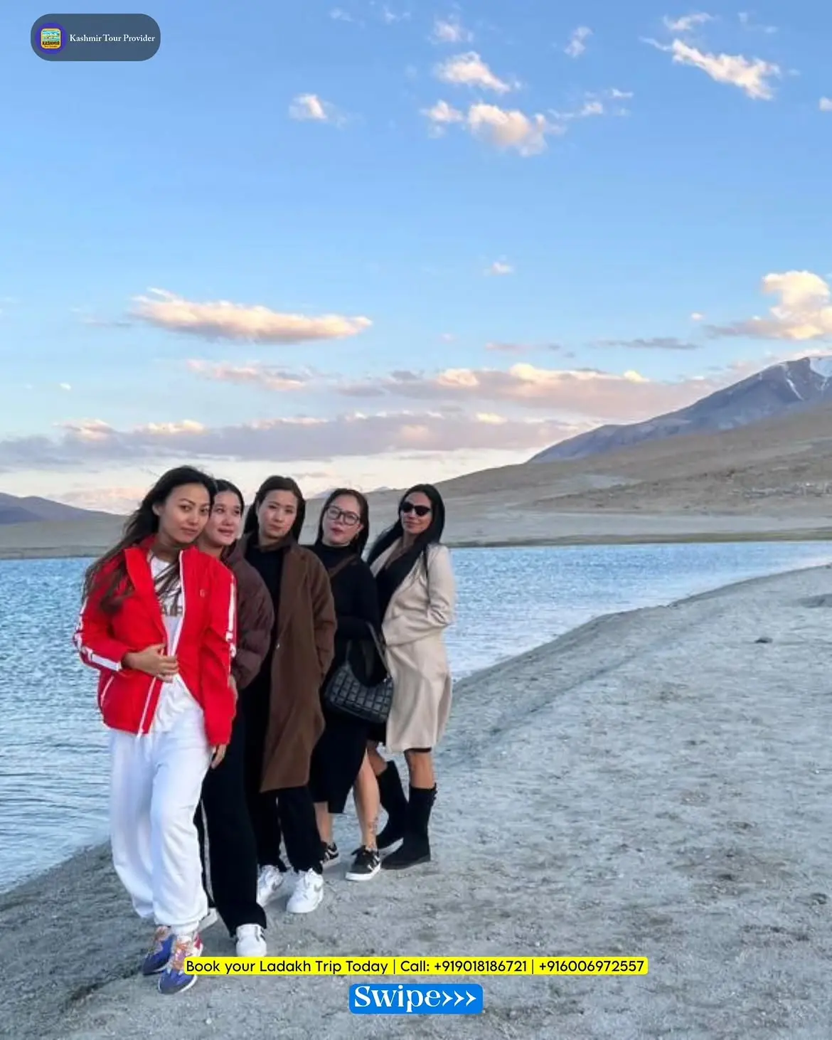 Our clients enjoying the breathtaking views of Pangong Lake during their Ladakh tour with Kashmir Tour Provider